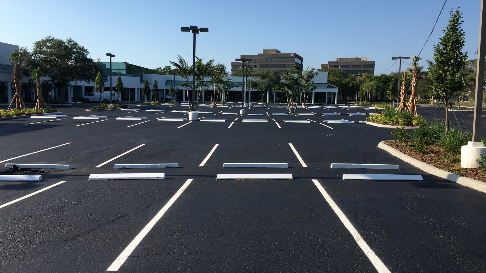 Parking lot spaces with thermoplastic paint