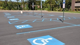Empty Handiccaped Parking Lot With Blue Stripes